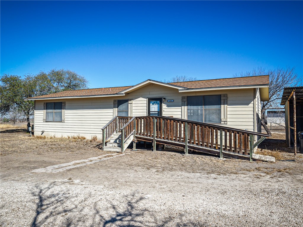 180 Recreation Road 8 Calliham, TX 78007 - Photo 1 of 17 a view of a house with wooden fence