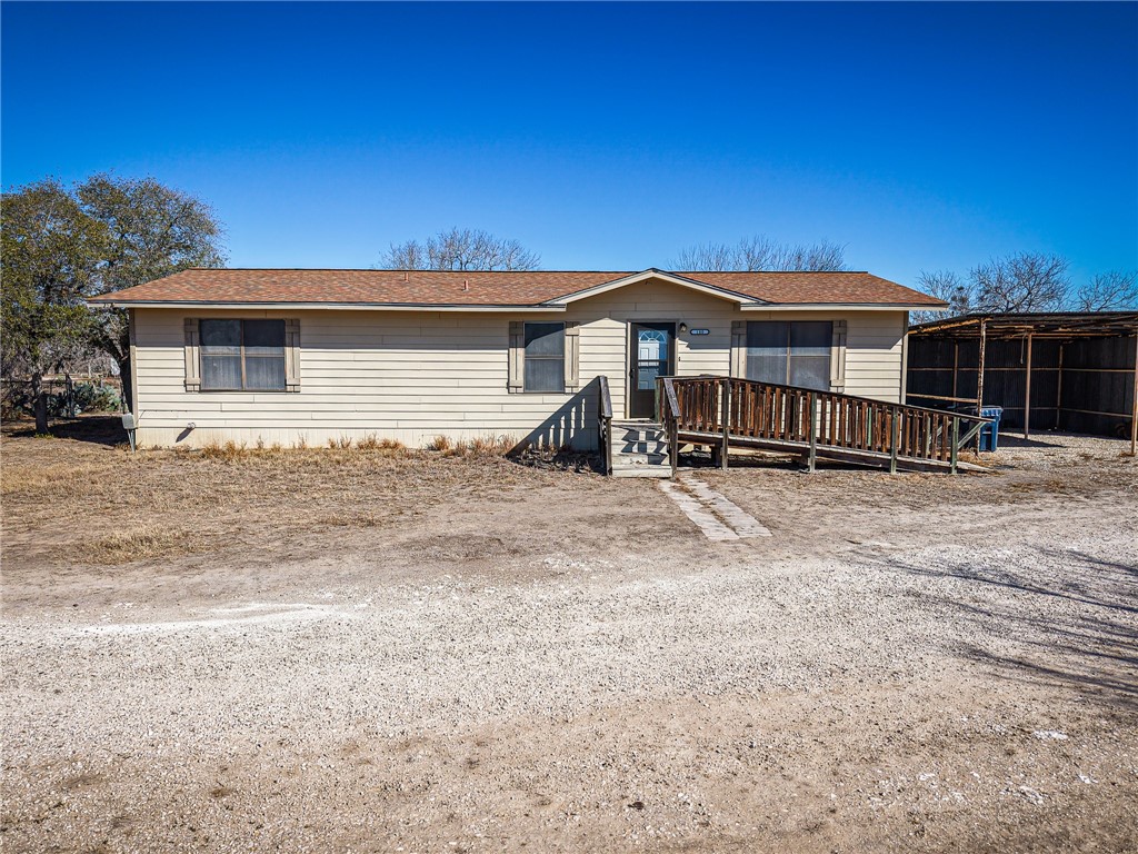 180 Recreation Road 8 Calliham, TX 78007 - Photo 2 of 17 a front view of a house with a yard