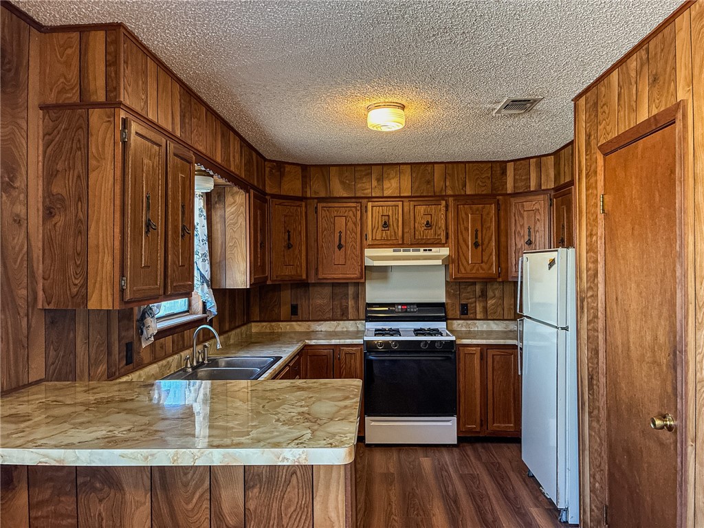 180 Recreation Road 8 Calliham, TX 78007 - Photo 9 of 17 a kitchen with stainless steel appliances granite countertop a sink stove and refrigerator