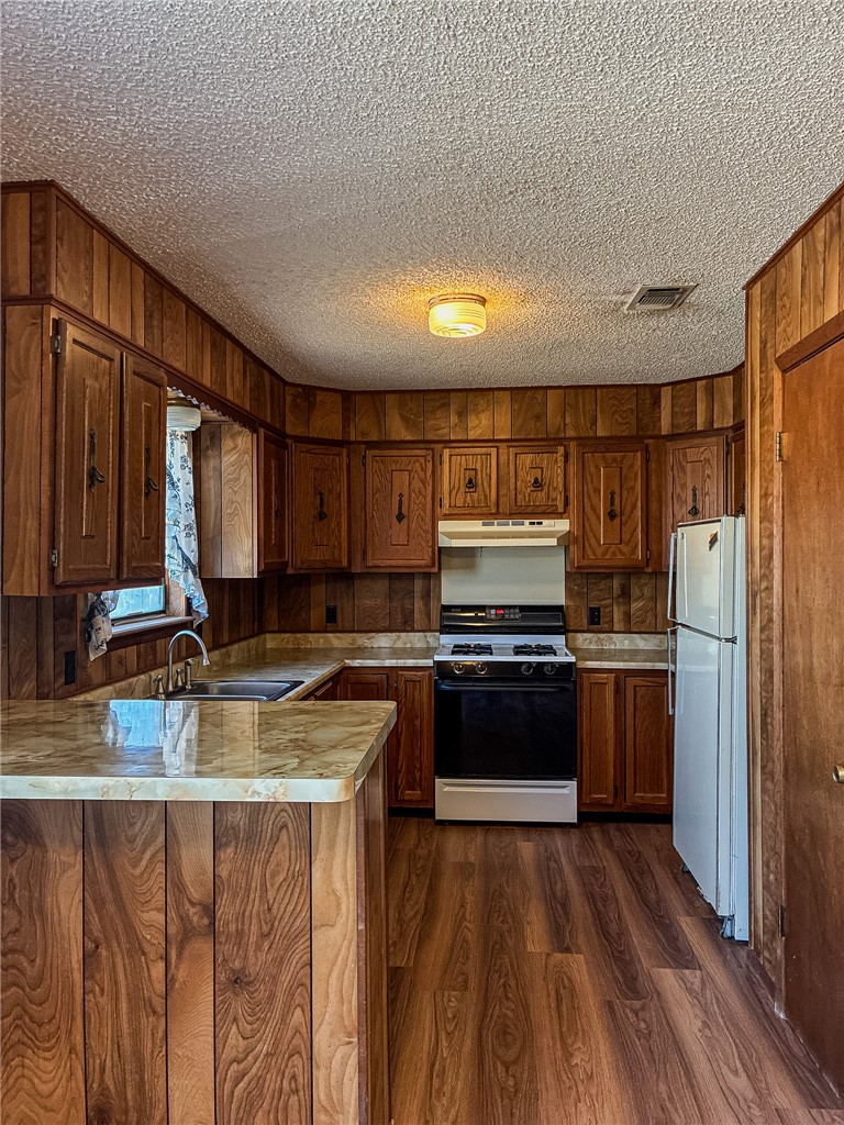 180 Recreation Road 8 Calliham, TX 78007 - Photo 10 of 17 a kitchen with a refrigerator stove and sink