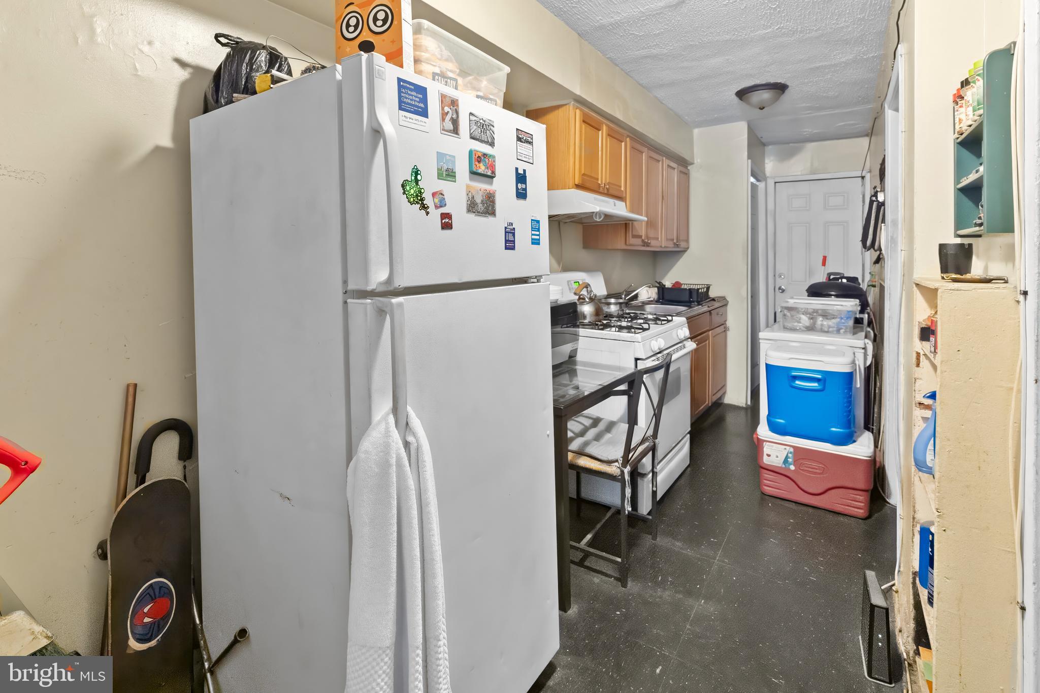 968 Mt Olivet Road Northeast Washington, DC 20002 - Photo 3 of 16 a kitchen with stainless steel appliances a refrigerator and a stove