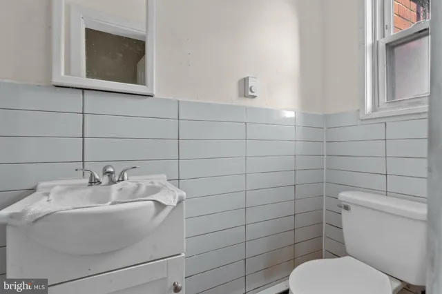 a bathroom with a toilet and sink