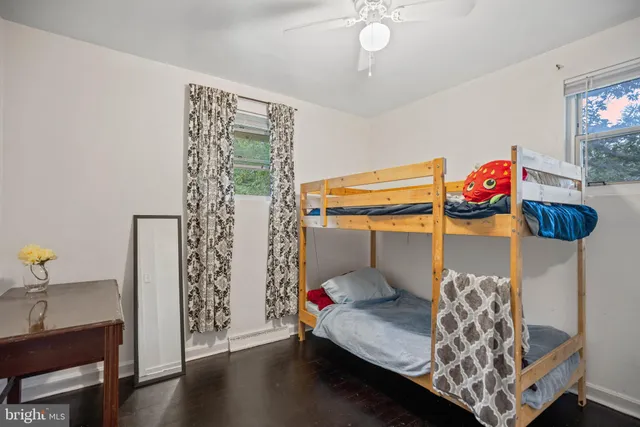 a bedroom with bed and a window