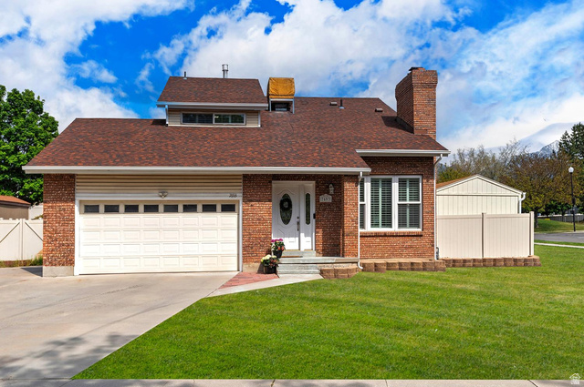 7693 Chad Street Midvale, UT 84047 - Photo 1 of 1 View of front of house. .**Pictures of yard are AI generated and reflect grass in yard. Seller is having a new sprinkler system installed and will reseed the yard at buyer's request**