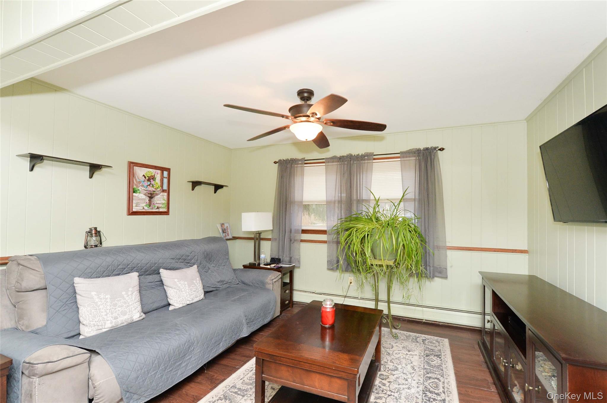 130 Spring Street Goshen, NY 10924 - Photo 11 of 24 a living room with furniture and a flat screen tv