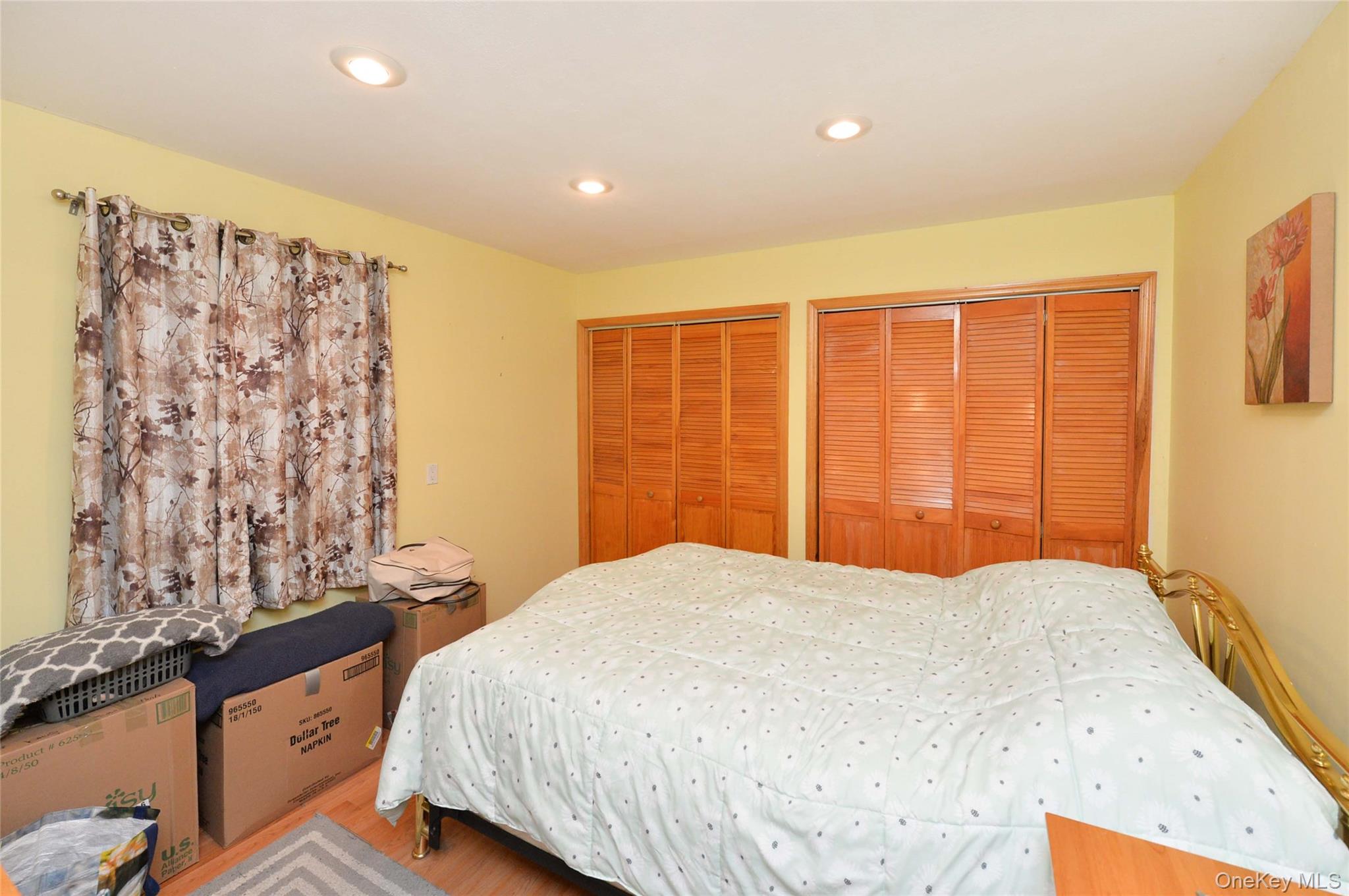 130 Spring Street Goshen, NY 10924 - Photo 14 of 24 a bedroom with a bed and a dresser
