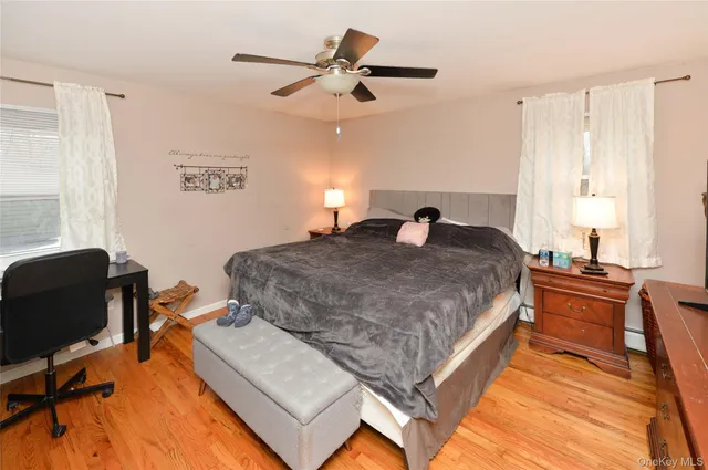 a bedroom with a bed window and a desk