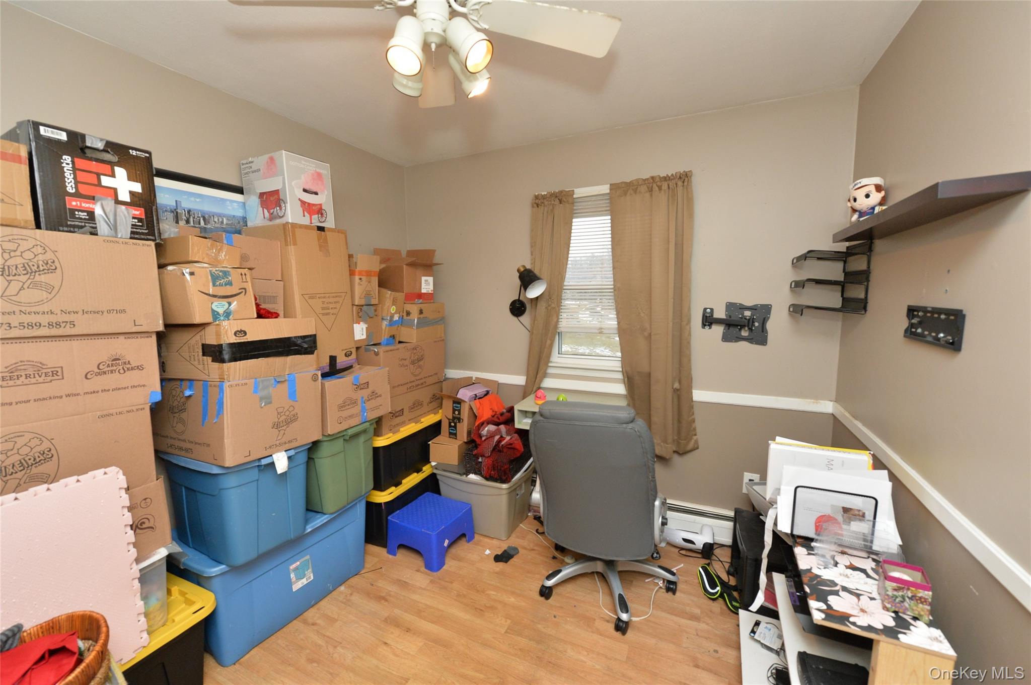 130 Spring Street Goshen, NY 10924 - Photo 18 of 24 a living room with furniture and a chandelier