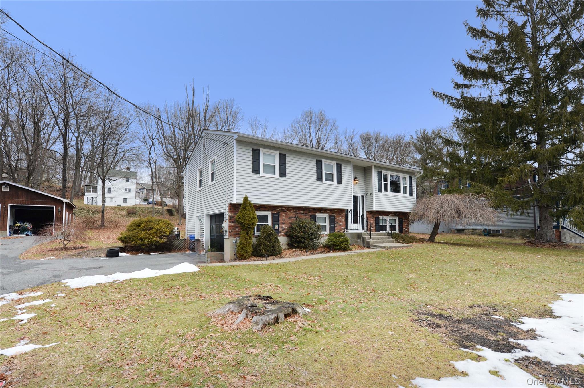 130 Spring Street Goshen, NY 10924 - Photo 2 of 24 a view of a house with snow in the yard