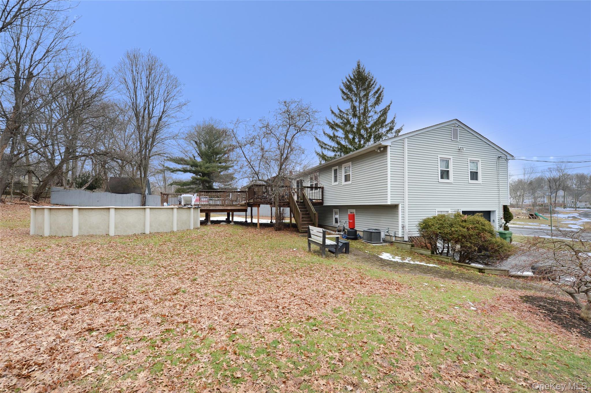 130 Spring Street Goshen, NY 10924 - Photo 24 of 24 a backyard of a house with table and chairs