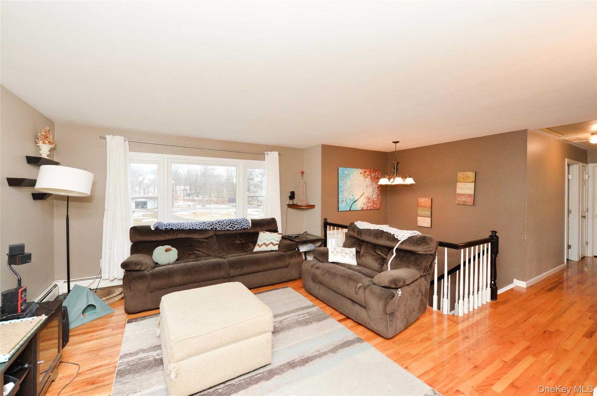 130 Spring Street Goshen, NY 10924 - Photo 6 of 24 a living room with furniture a lamp and a table