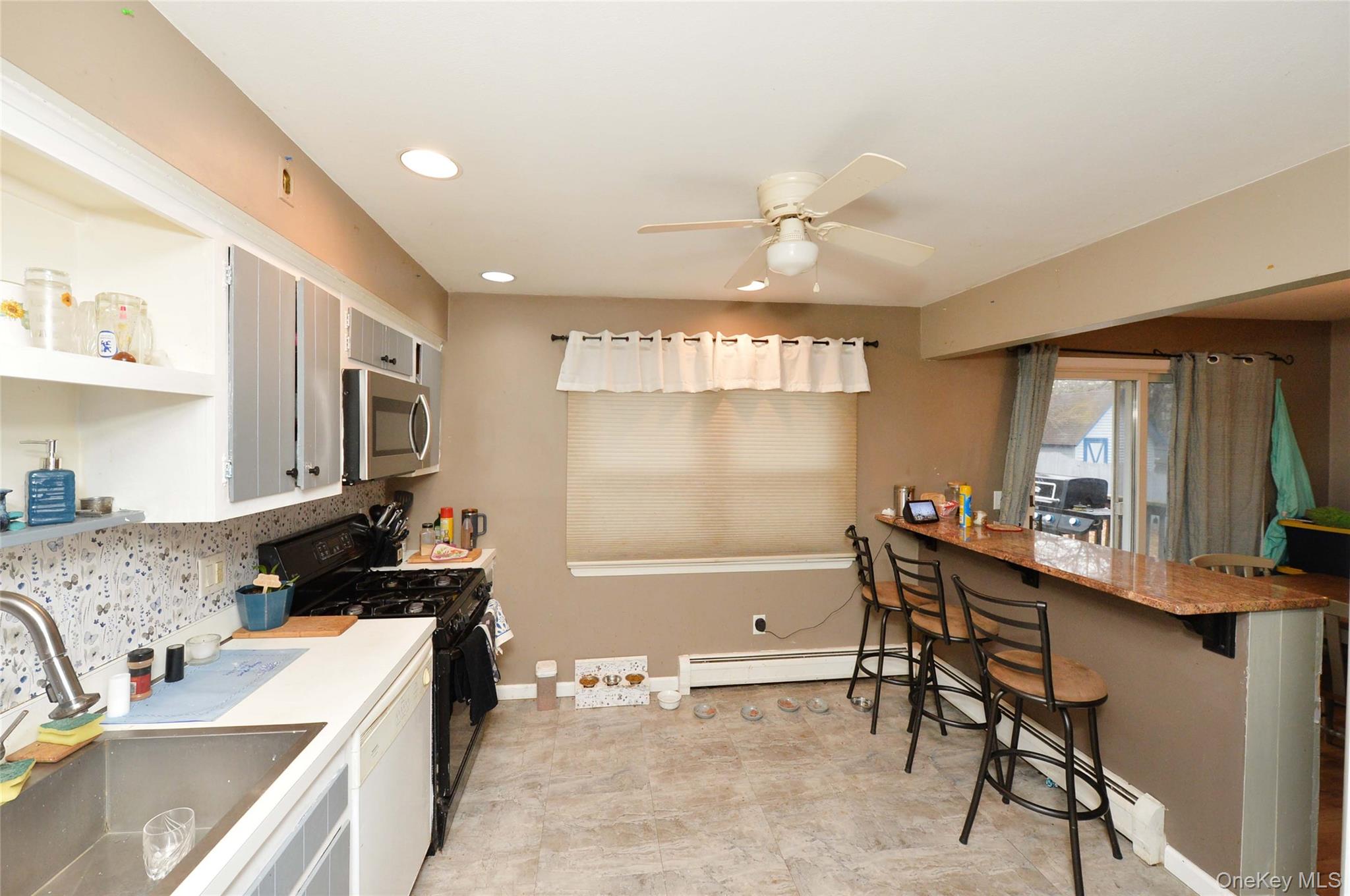 130 Spring Street Goshen, NY 10924 - Photo 9 of 24 a kitchen that has a sink and a stove in it