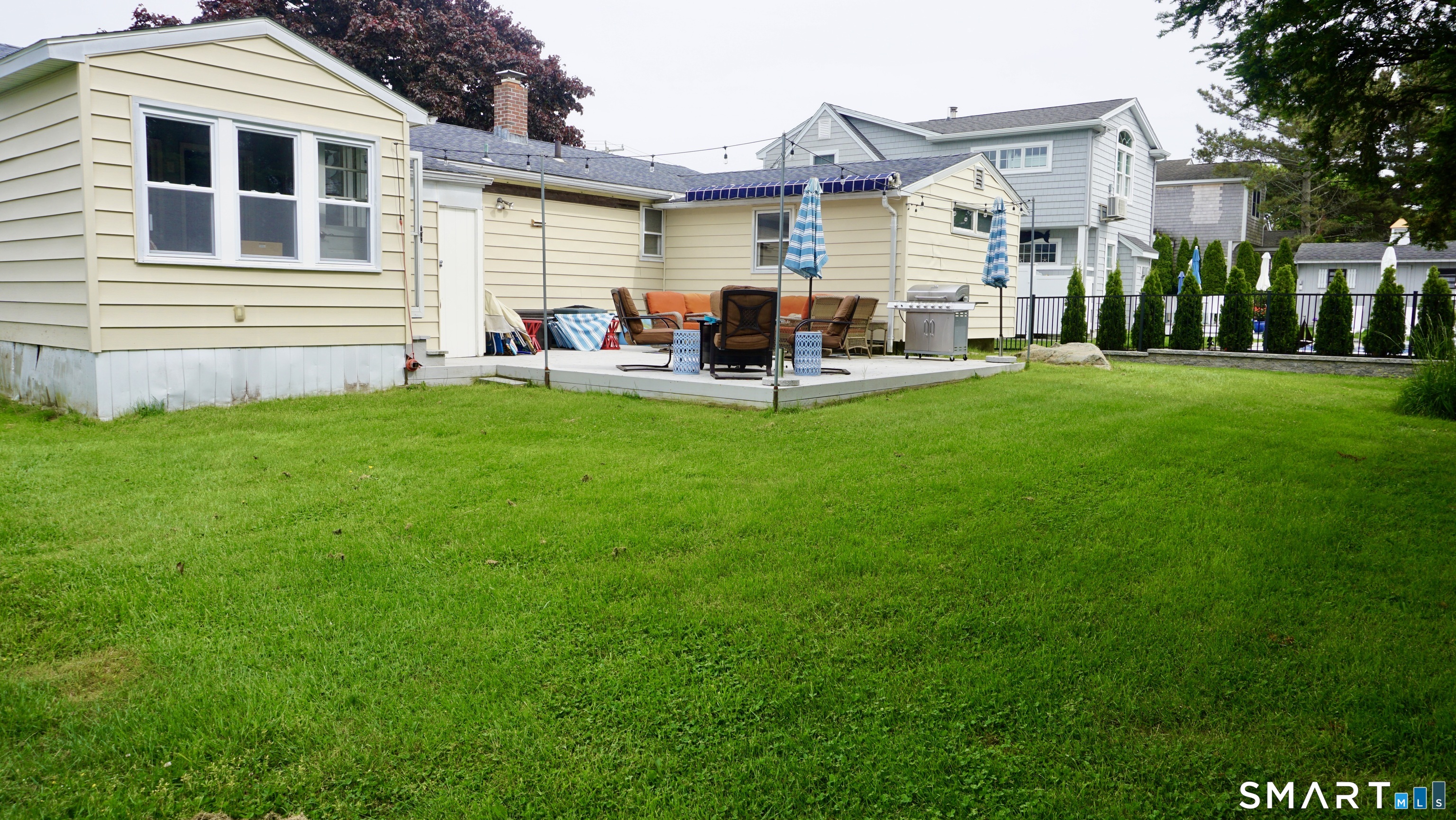 13 Pacific Street Groton, CT 06340 - Photo 21 of 31 a group of people sitting in front of a house