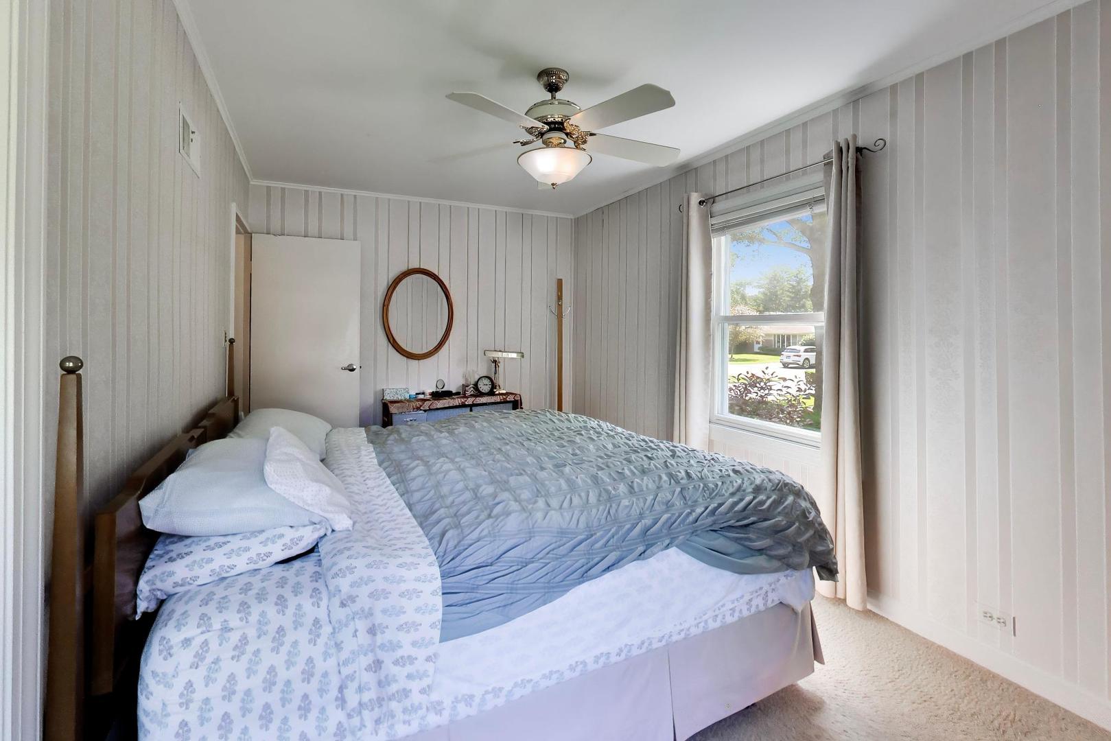 103 Cottonwood Road Northbrook, IL 60062 - Photo 23 of 50 a bed sitting in a bedroom next to a window