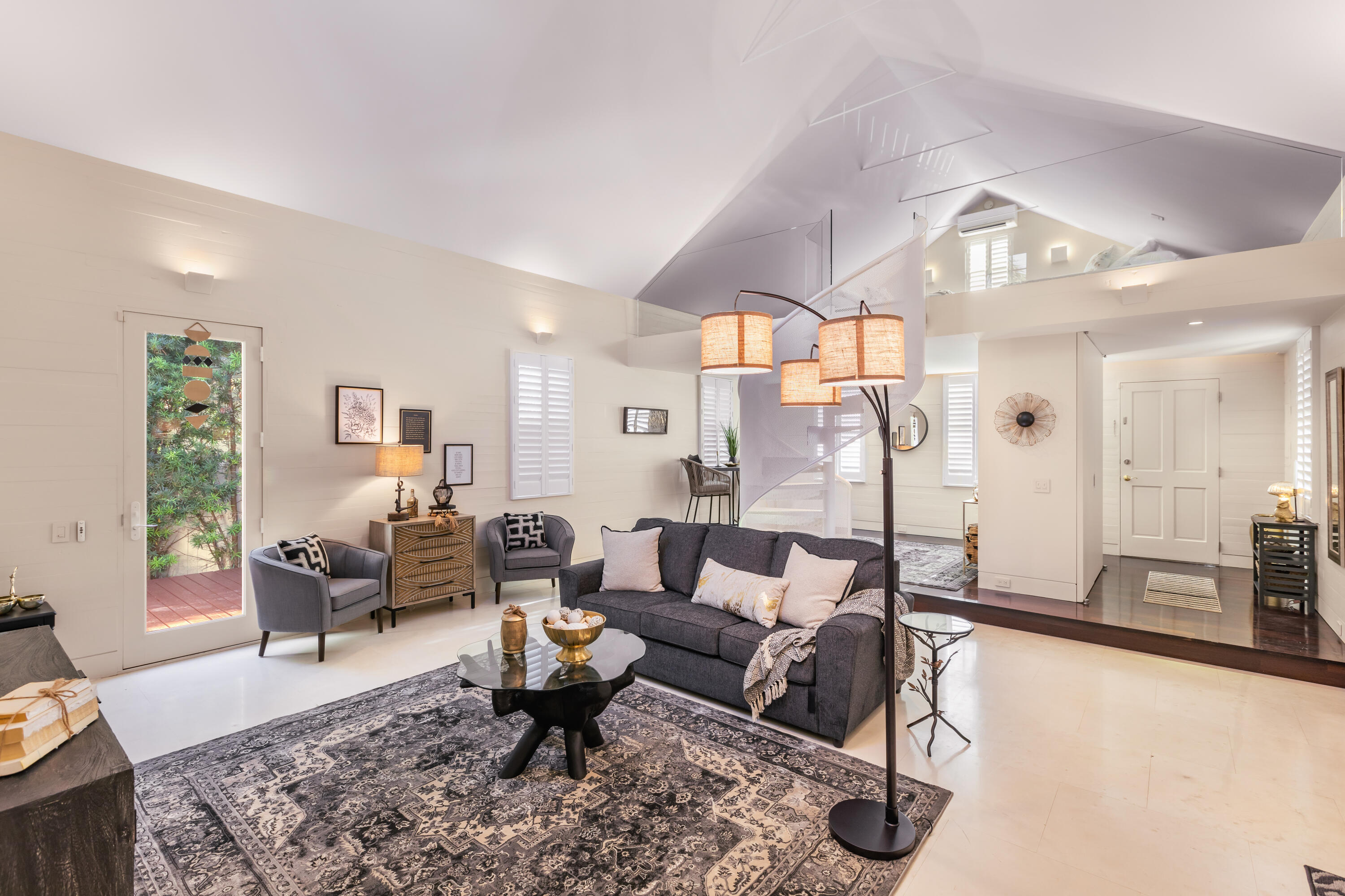 711 Elizabeth Street Key West, FL 33040 - Photo 13 of 36 a living room with furniture and a chandelier