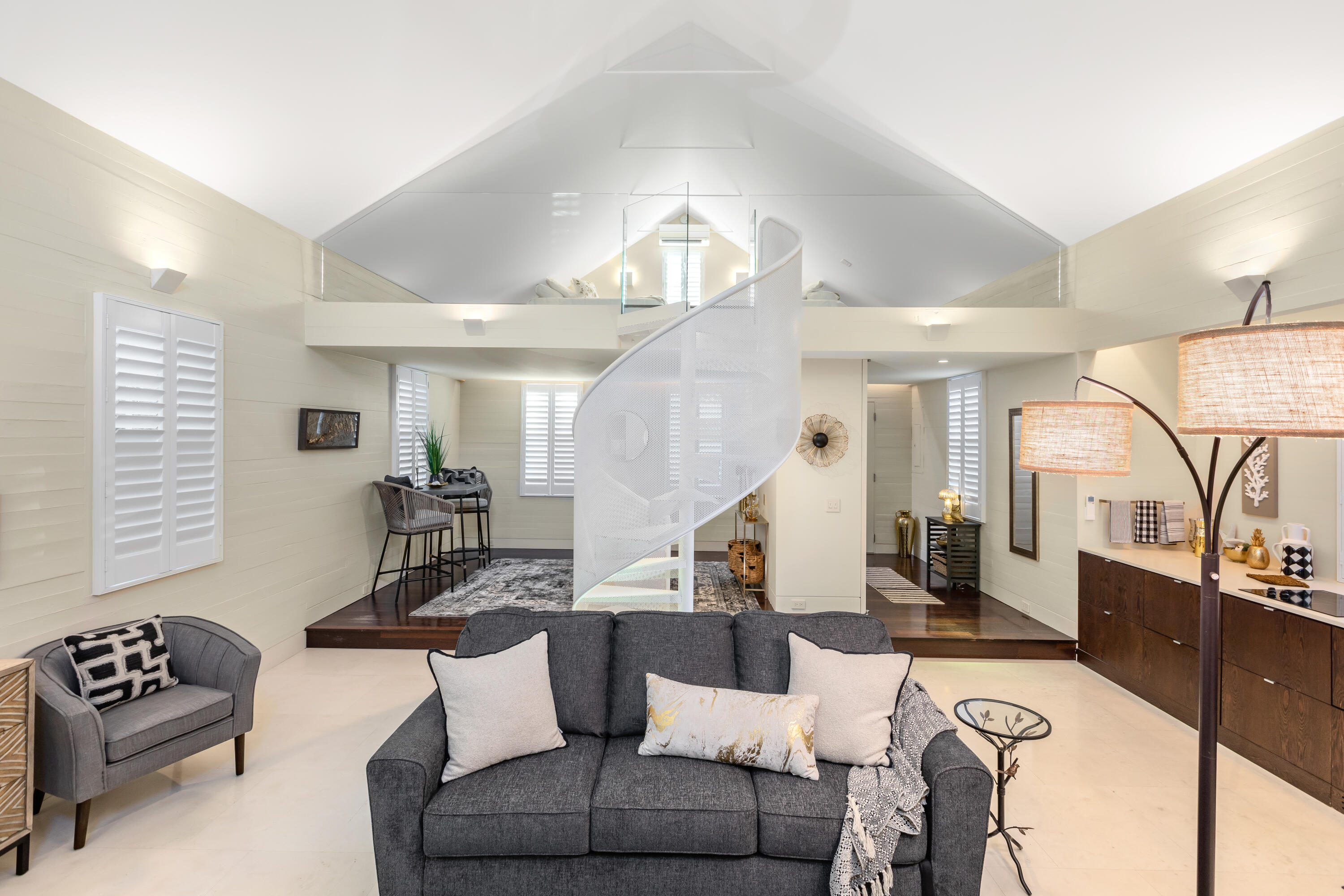 711 Elizabeth Street Key West, FL 33040 - Photo 20 of 36 a living room with furniture and wooden floor