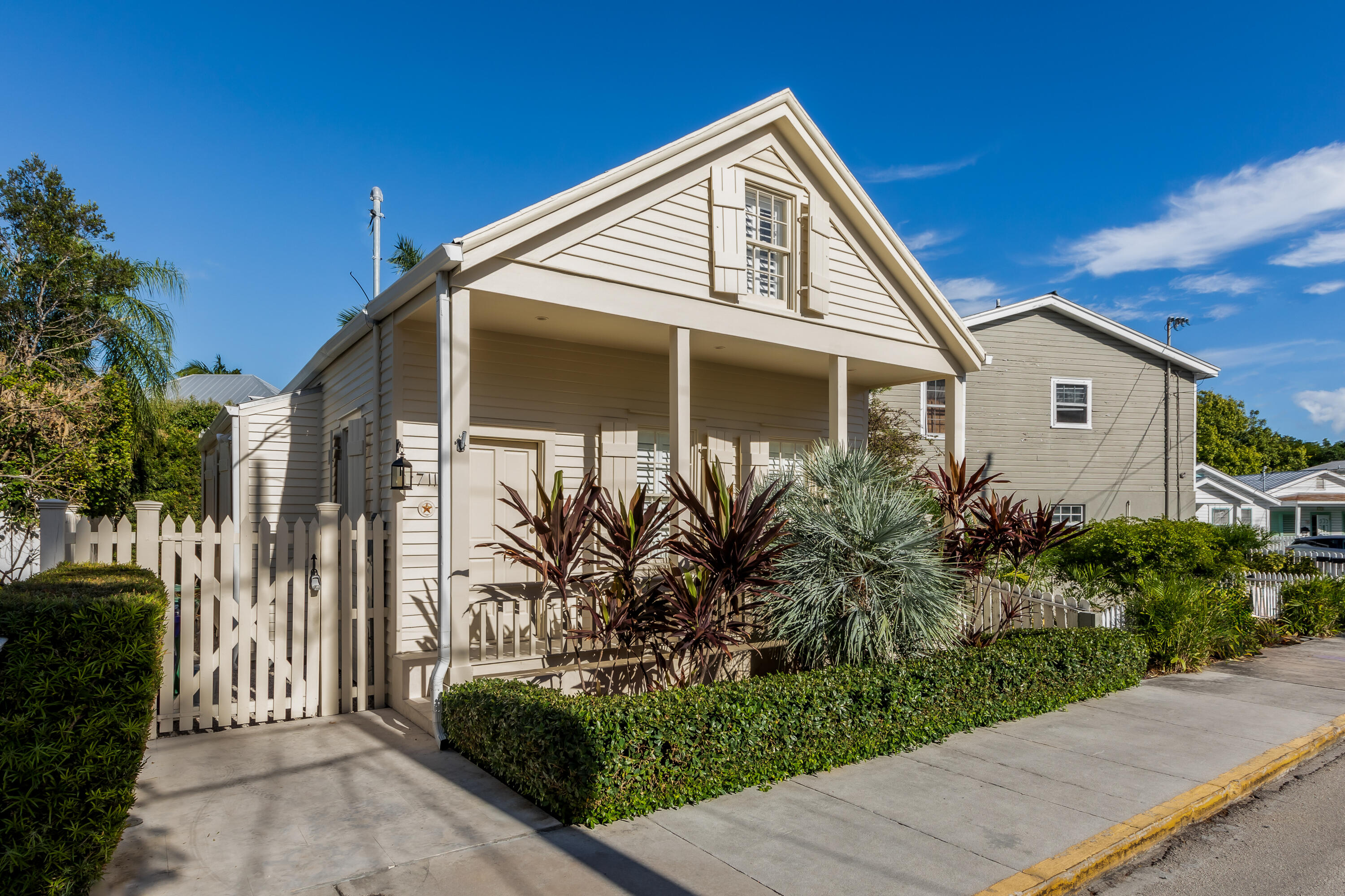 711 Elizabeth Street Key West, FL 33040 - Photo 2 of 36 a front view of a house with garden