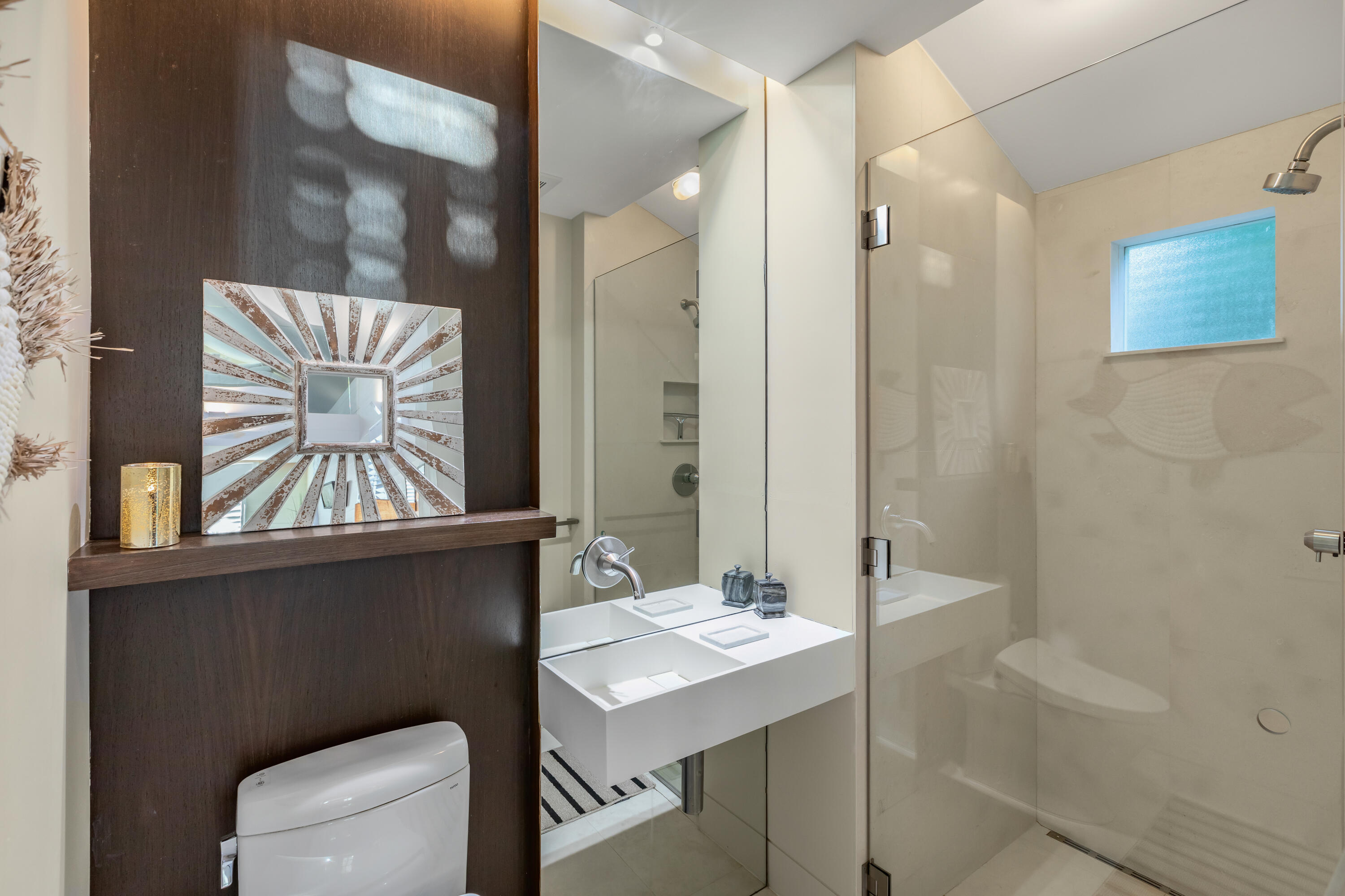 711 Elizabeth Street Key West, FL 33040 - Photo 25 of 36 a bathroom with a sink a toilet and a mirror