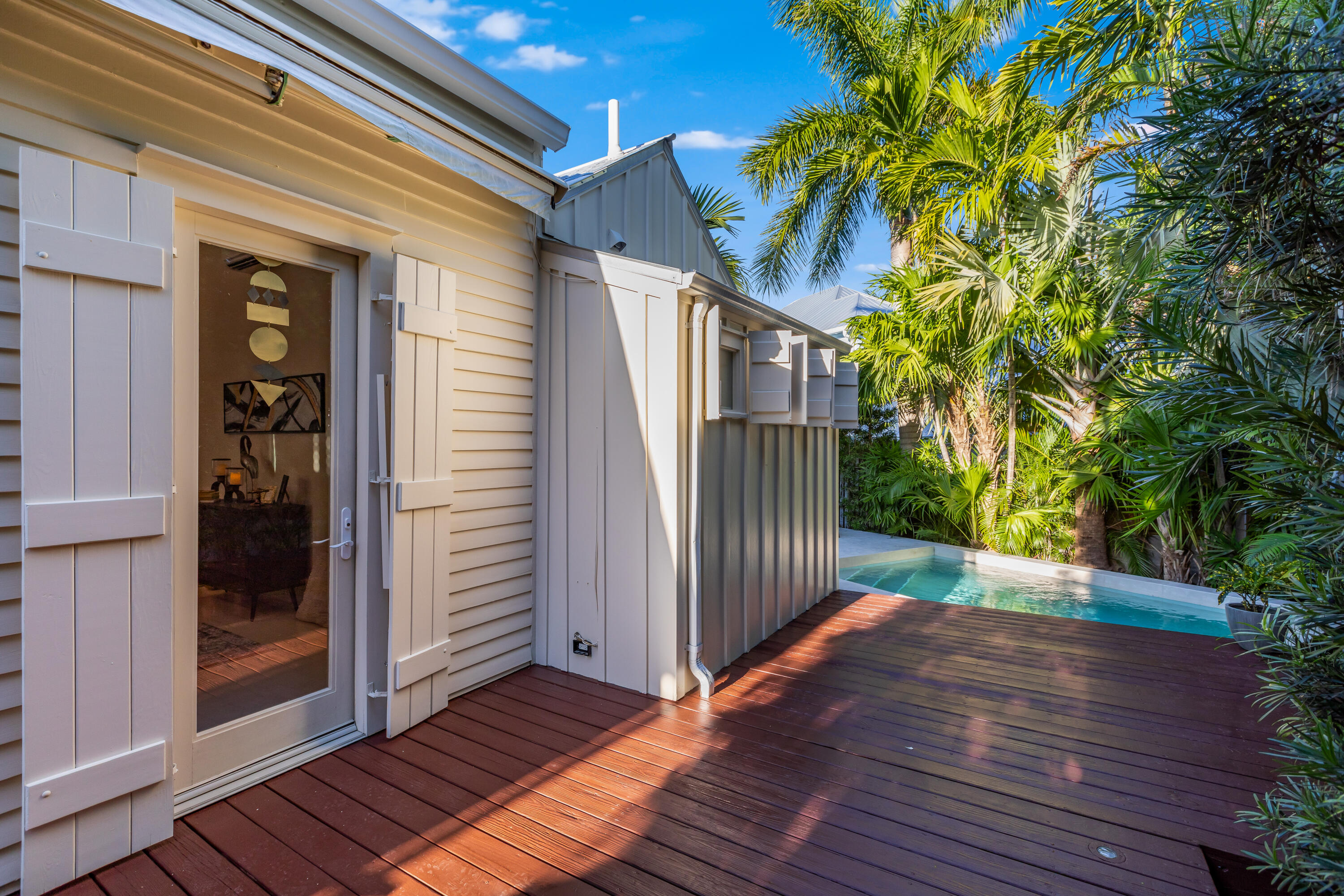 711 Elizabeth Street Key West, FL 33040 - Photo 31 of 36 a view of a porch with wooden floor and stairs