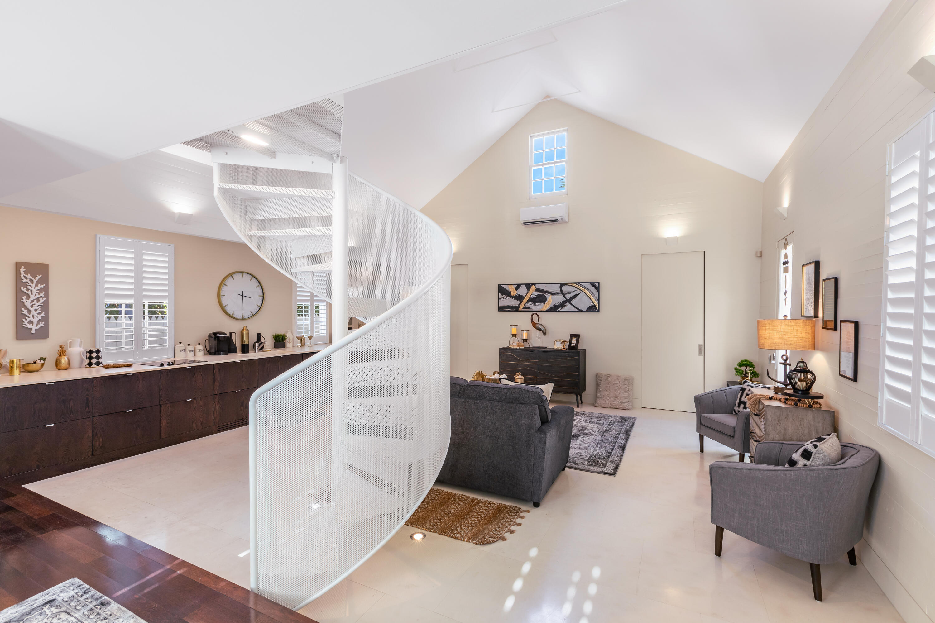 711 Elizabeth Street Key West, FL 33040 - Photo 7 of 36 a living room with furniture and a clock