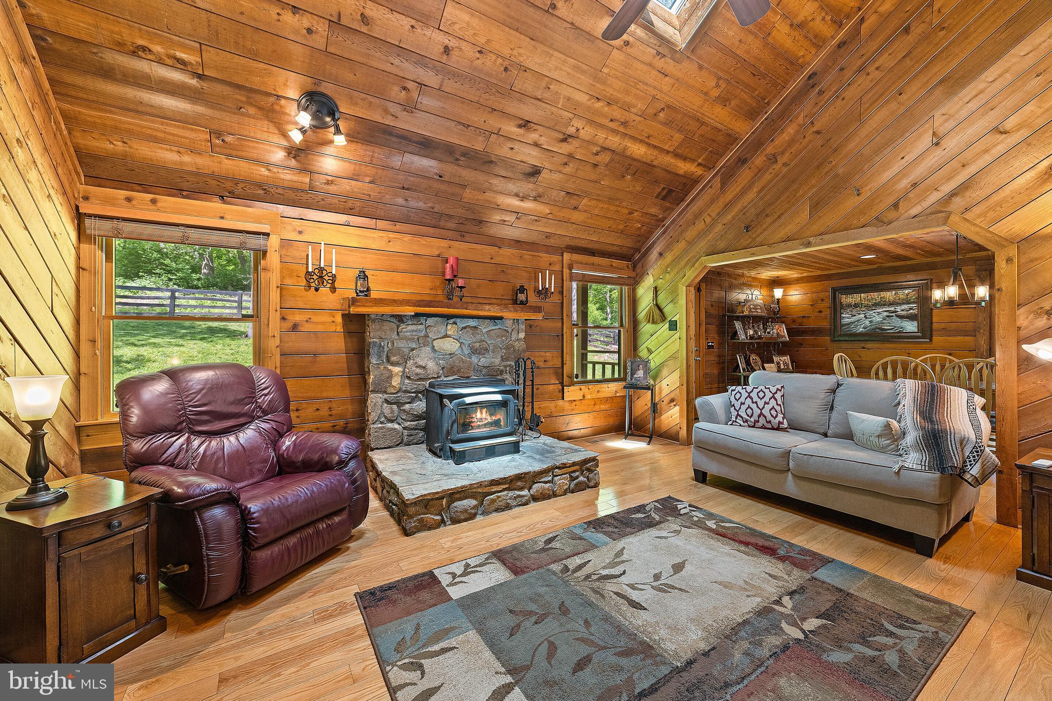 19315 Blue Ridge Mountain Road Bluemont, VA 20135 - Photo 43 of 75 Cozy living room w Stone Hearth and Wood Stove
