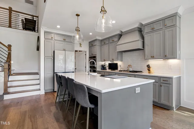 a kitchen that has a lot of cabinets in it