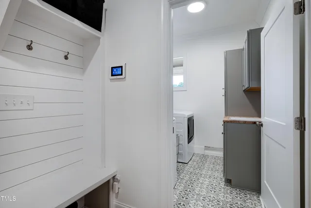 a bathroom with a tub a toilet and a shower