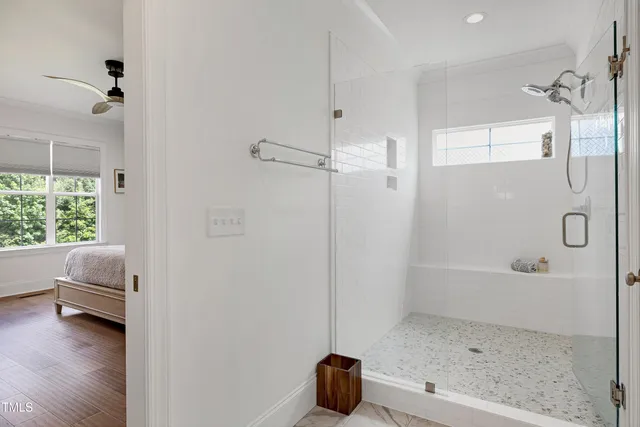 a bathroom with a double vanity sink a mirror and a bathtub