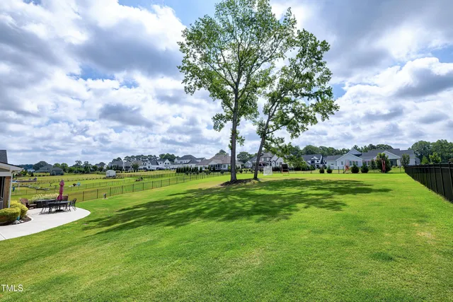 an aerial view of a house with outdoor swimming pool