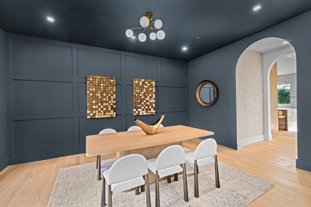 36 Roland Street Newton, MA 02461 - Photo 16 of 42 a view of a dining room with furniture and a chandelier