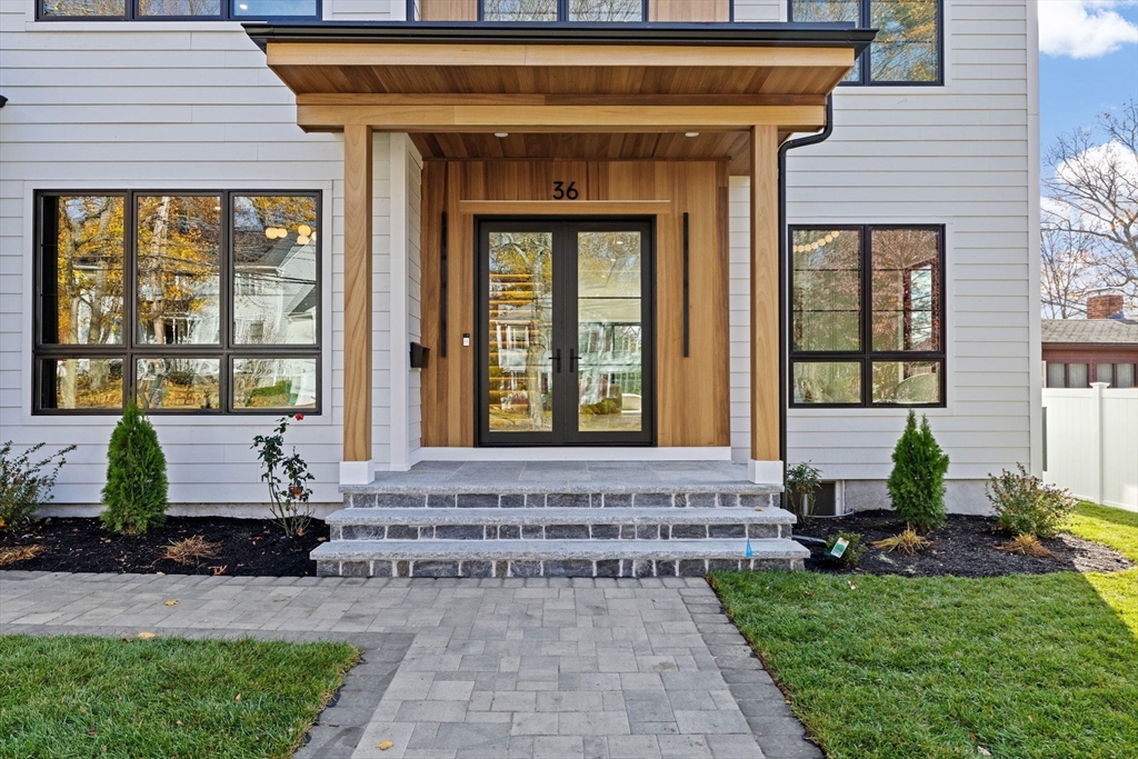 36 Roland Street Newton, MA 02461 - Photo 2 of 42 a front view of a house with a porch