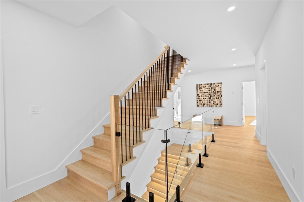 36 Roland Street Newton, MA 02461 - Photo 21 of 42 a view of entryway and hall with wooden floor