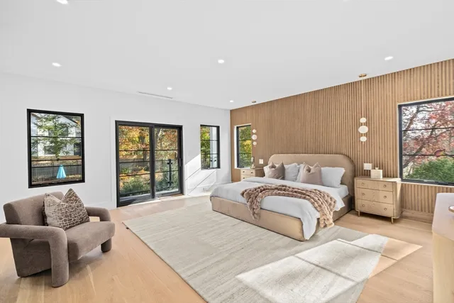 a spacious bedroom with a large bed and a window