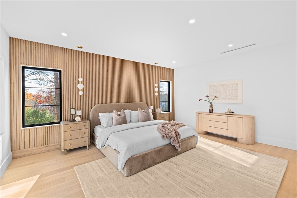 36 Roland Street Newton, MA 02461 - Photo 24 of 42 a spacious bedroom with a large bed and a window