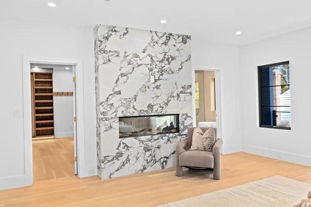 a bathroom with a sink and mirror with shower
