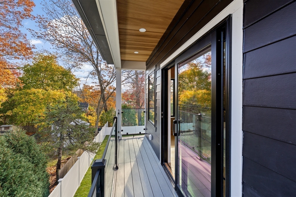 36 Roland Street Newton, MA 02461 - Photo 32 of 42 a view of balcony and wooden floor