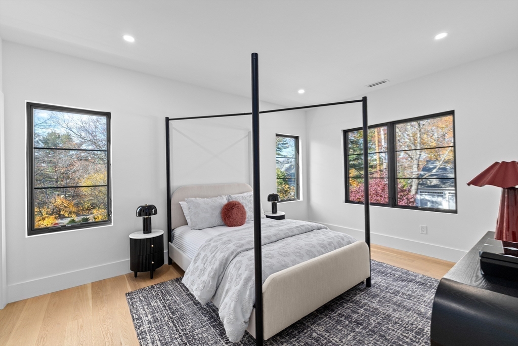 36 Roland Street Newton, MA 02461 - Photo 33 of 42 a bedroom with a large bed and a window