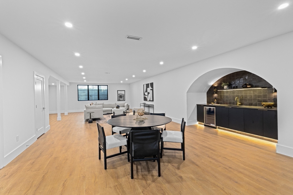 36 Roland Street Newton, MA 02461 - Photo 39 of 42 a view of a dining room with furniture and wooden floor