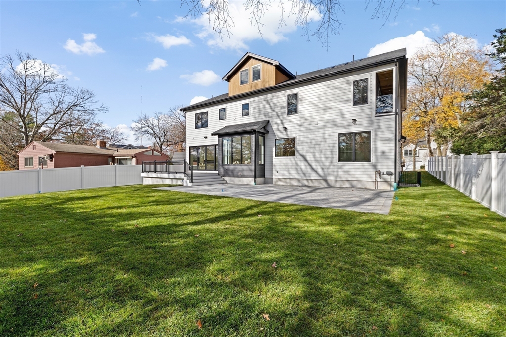 36 Roland Street Newton, MA 02461 - Photo 41 of 42 a front view of a house with garden