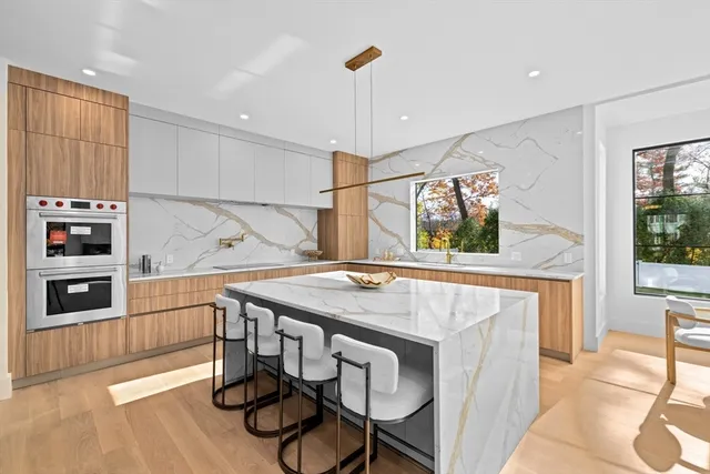 a kitchen with a table and chairs in it