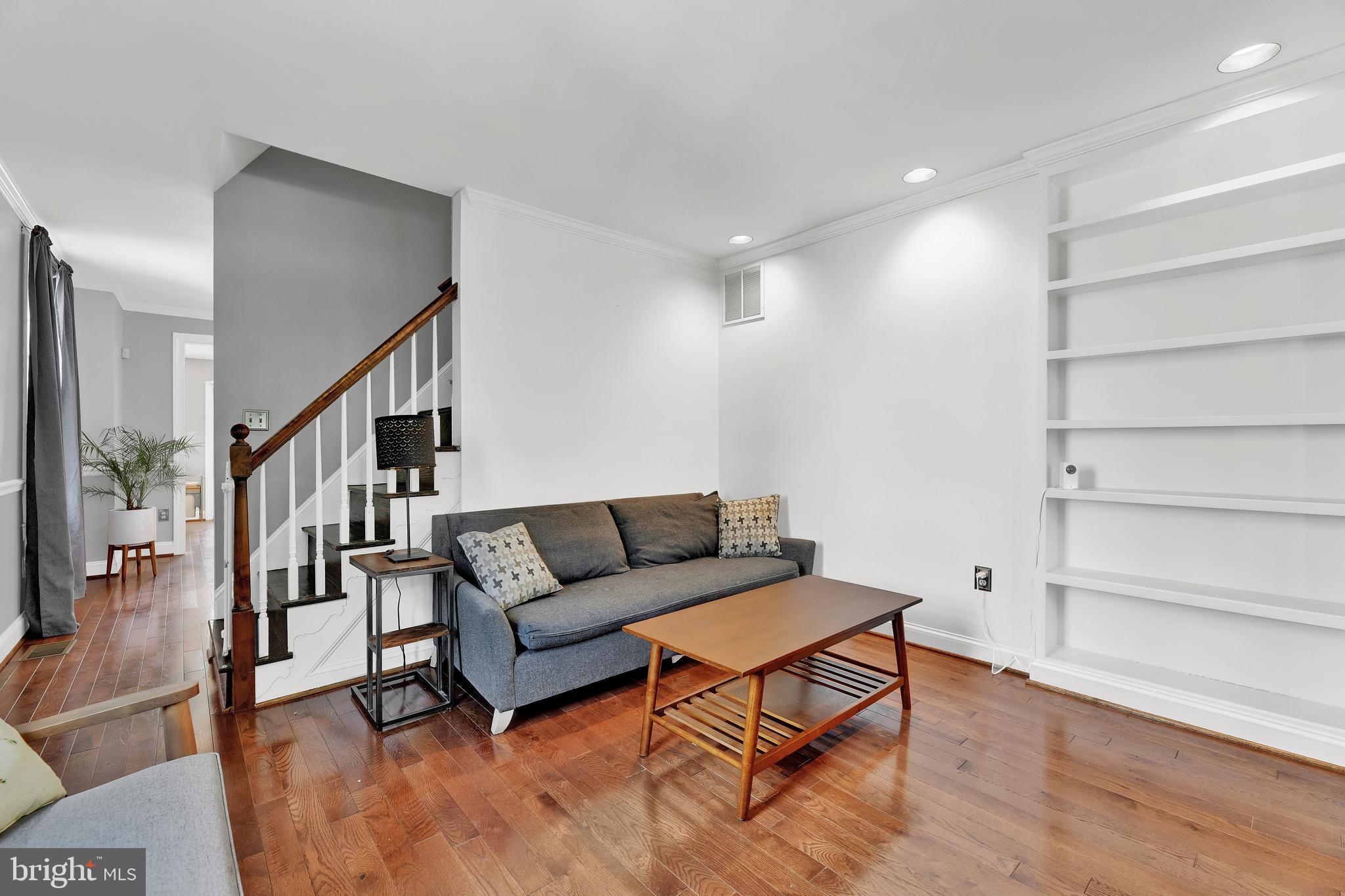 4541 Keswick Road Baltimore, MD 21210 - Photo 3 of 20 a living room with furniture and a wooden floor