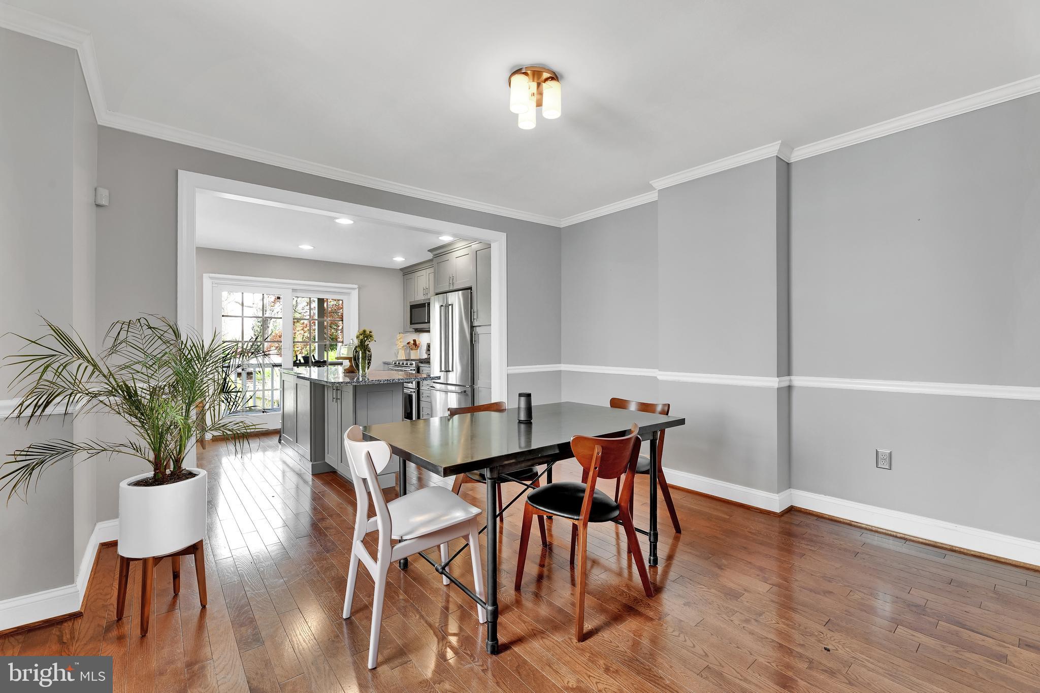 4541 Keswick Road Baltimore, MD 21210 - Photo 5 of 20 a view of a dining room with furniture and wooden floor