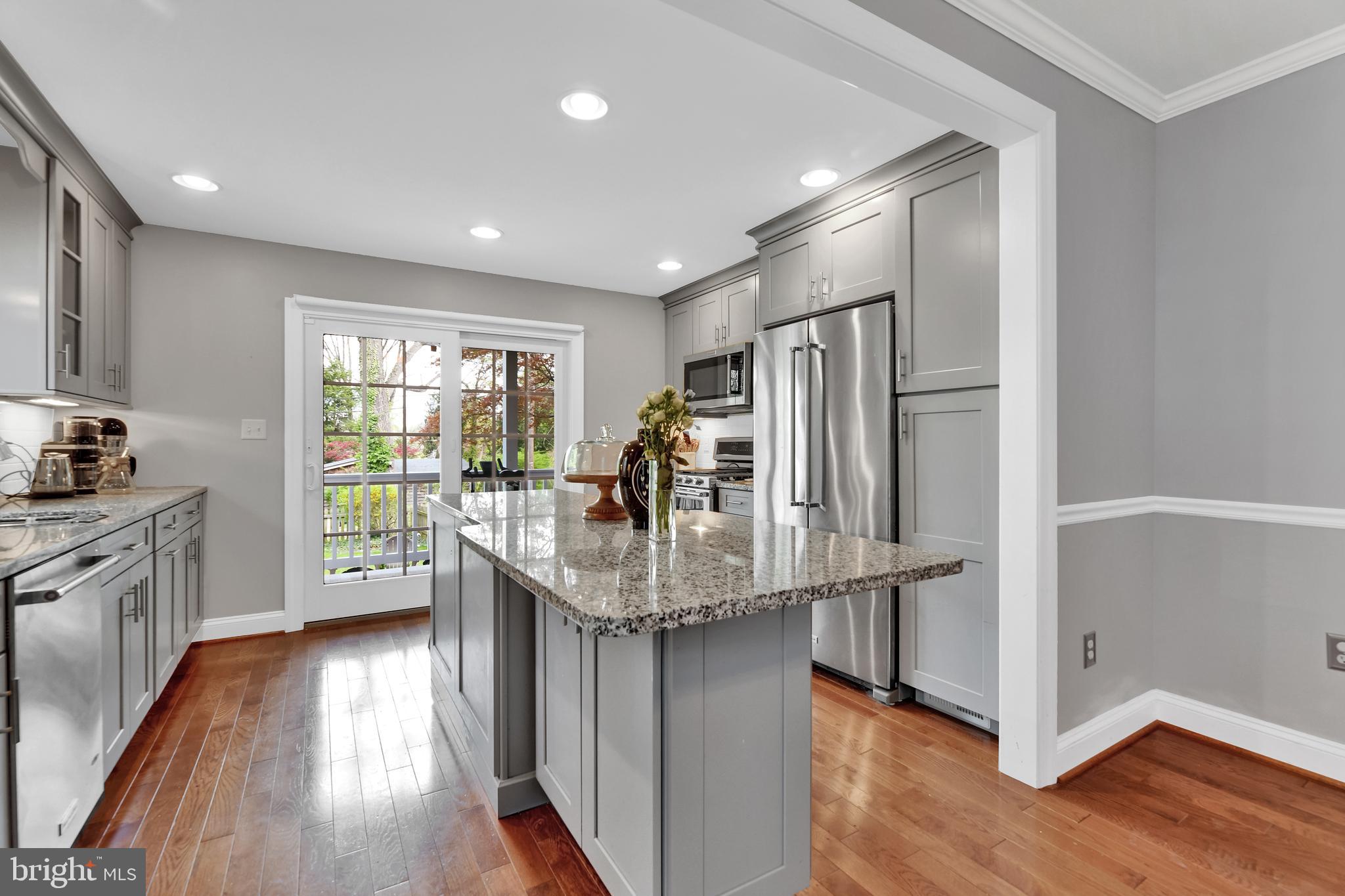 4541 Keswick Road Baltimore, MD 21210 - Photo 7 of 20 a kitchen with stainless steel appliances granite countertop a refrigerator and a sink