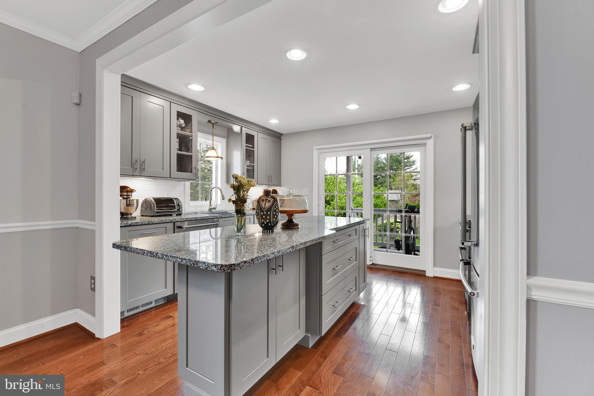 4541 Keswick Road Baltimore, MD 21210 - Photo 8 of 20 a kitchen with counter top space sink and wooden floor