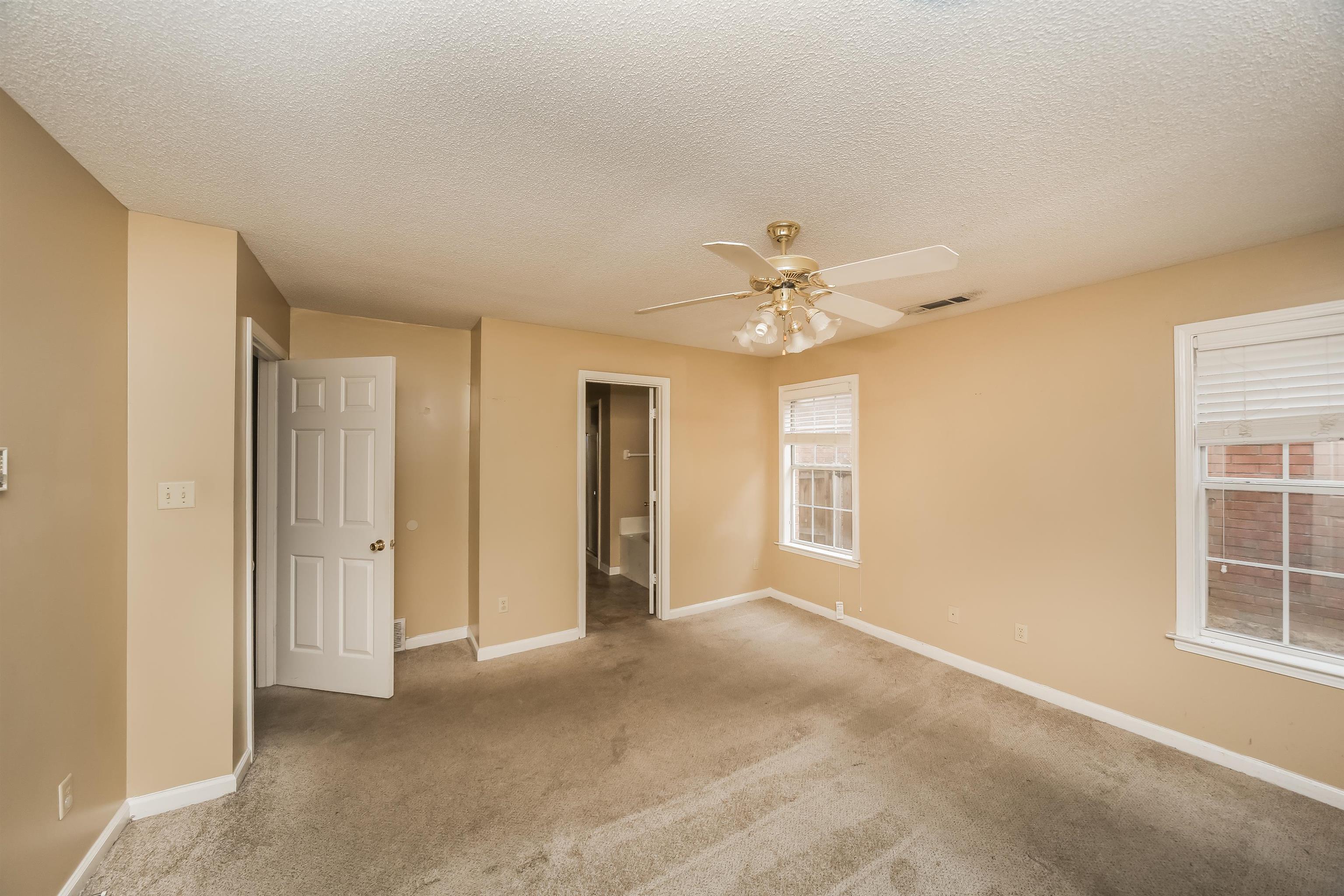 1036 Dusty Lane Cordova, TN 38018 - Photo 11 of 16 a view of an empty room with a window
