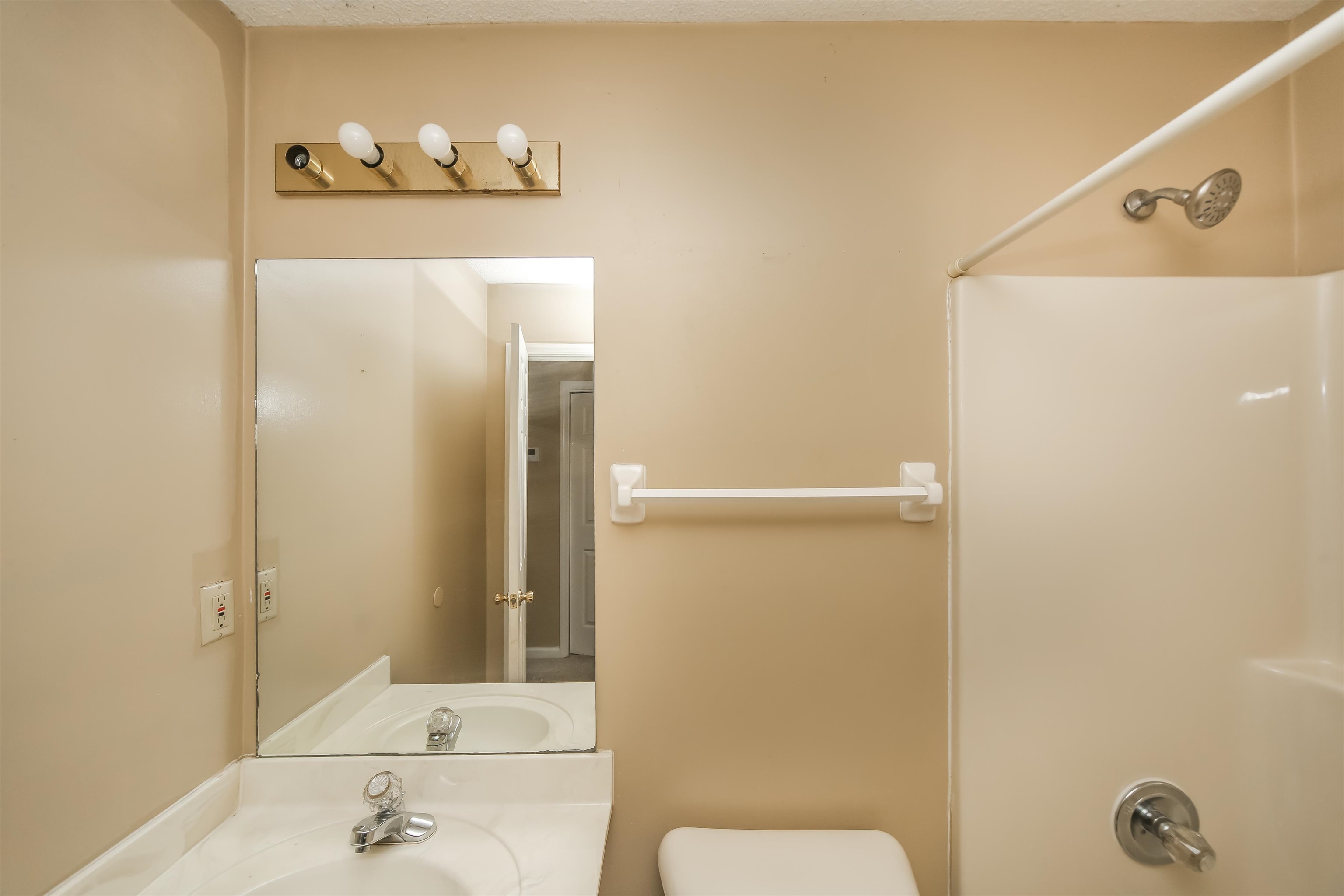 1036 Dusty Lane Cordova, TN 38018 - Photo 14 of 16 a bathroom with a sink and a mirror