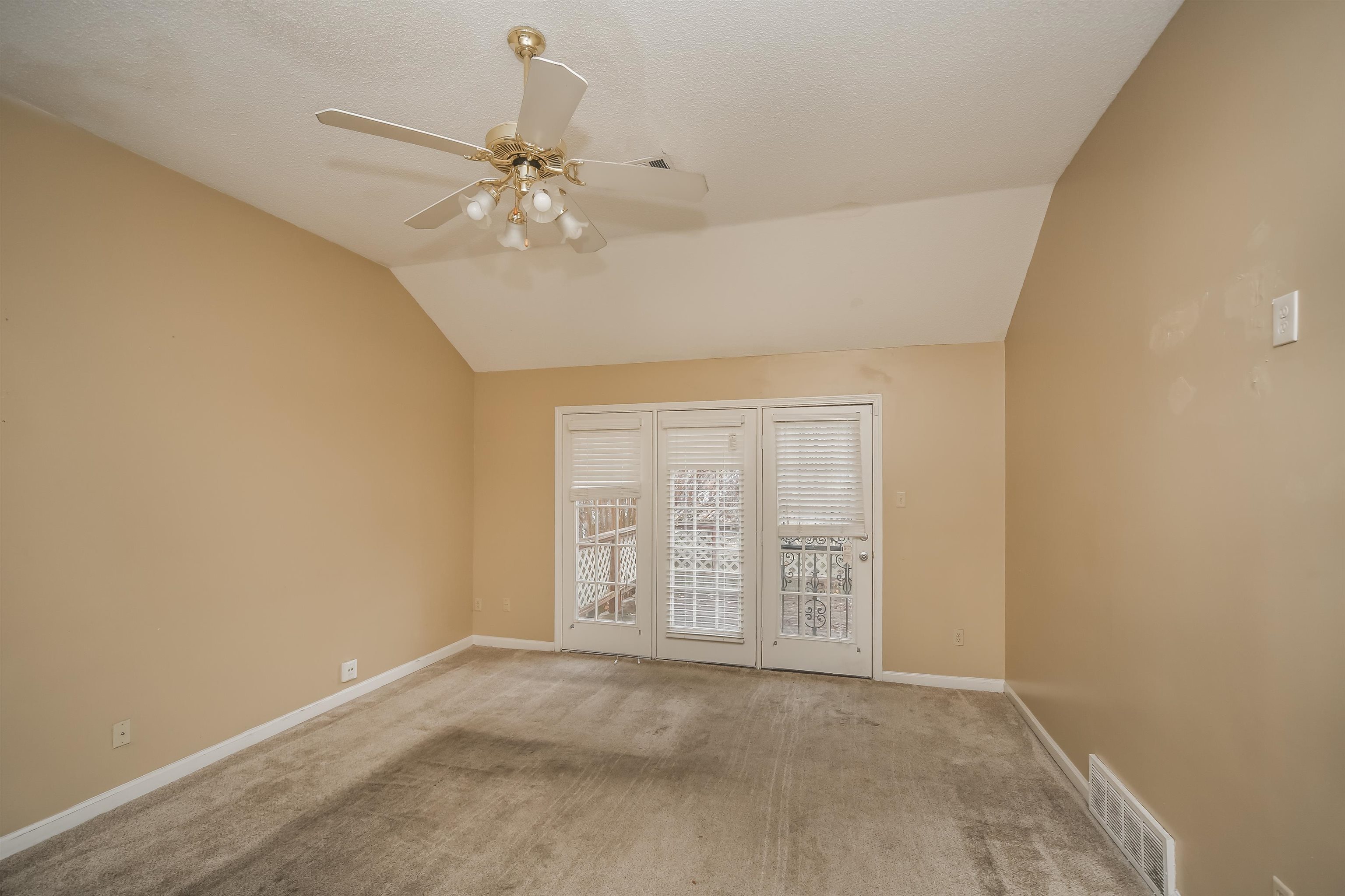 1036 Dusty Lane Cordova, TN 38018 - Photo 4 of 16 a view of an empty room with a window