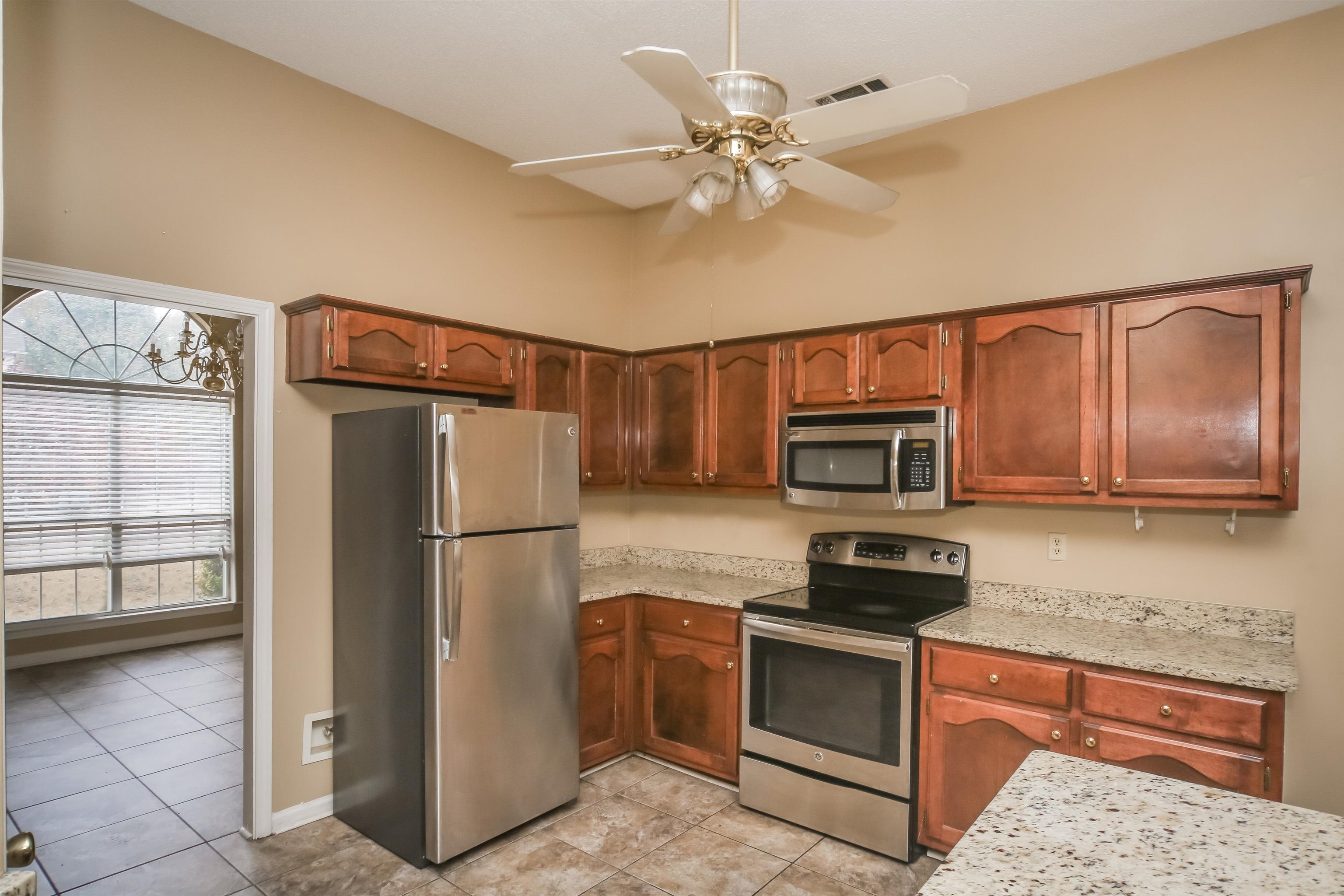 1036 Dusty Lane Cordova, TN 38018 - Photo 8 of 16 a kitchen with a refrigerator stove and microwave