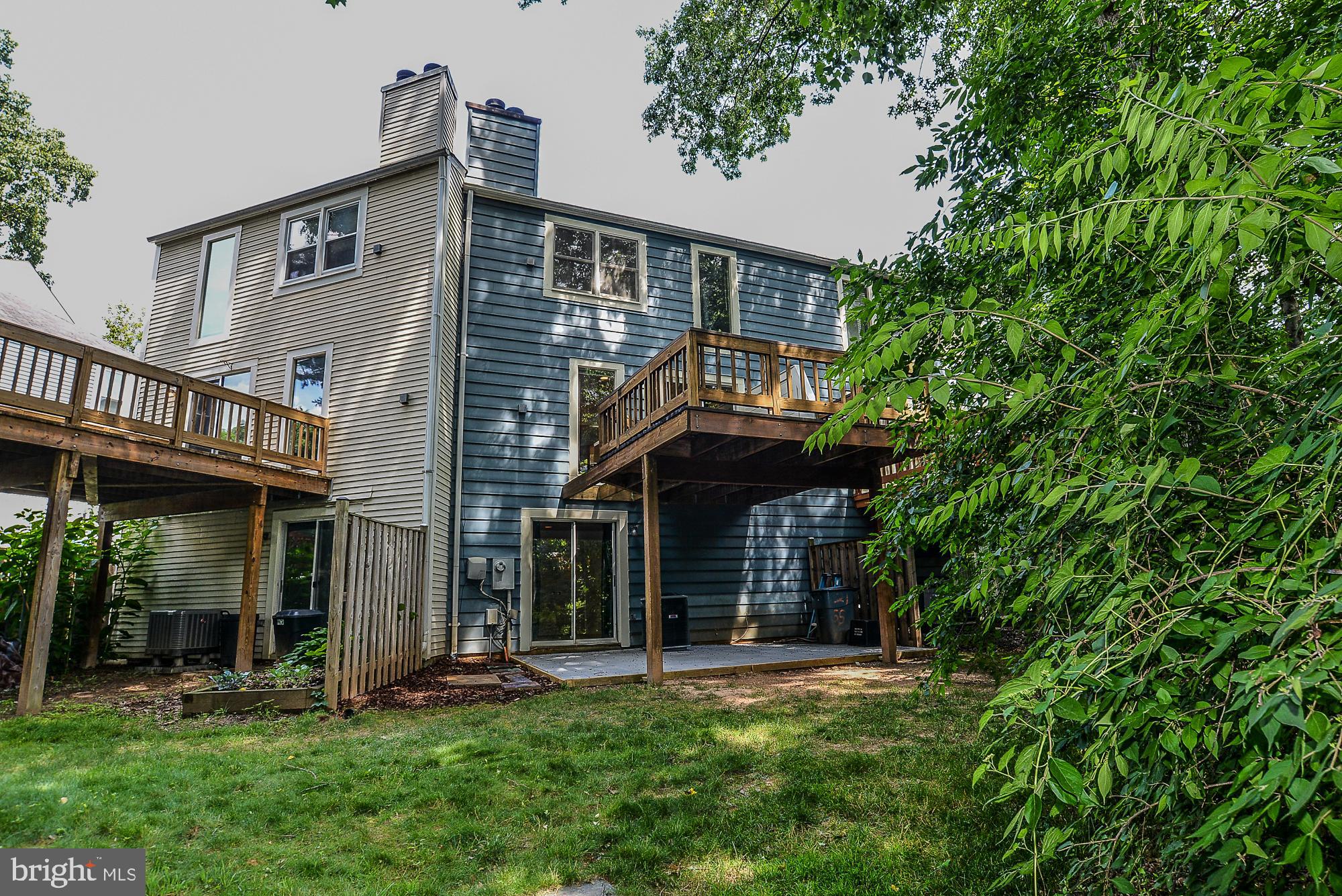 2155 Whisper Way Reston, VA 20191 - Photo 28 of 32 Deck & patio surrounded by wooded common ground
