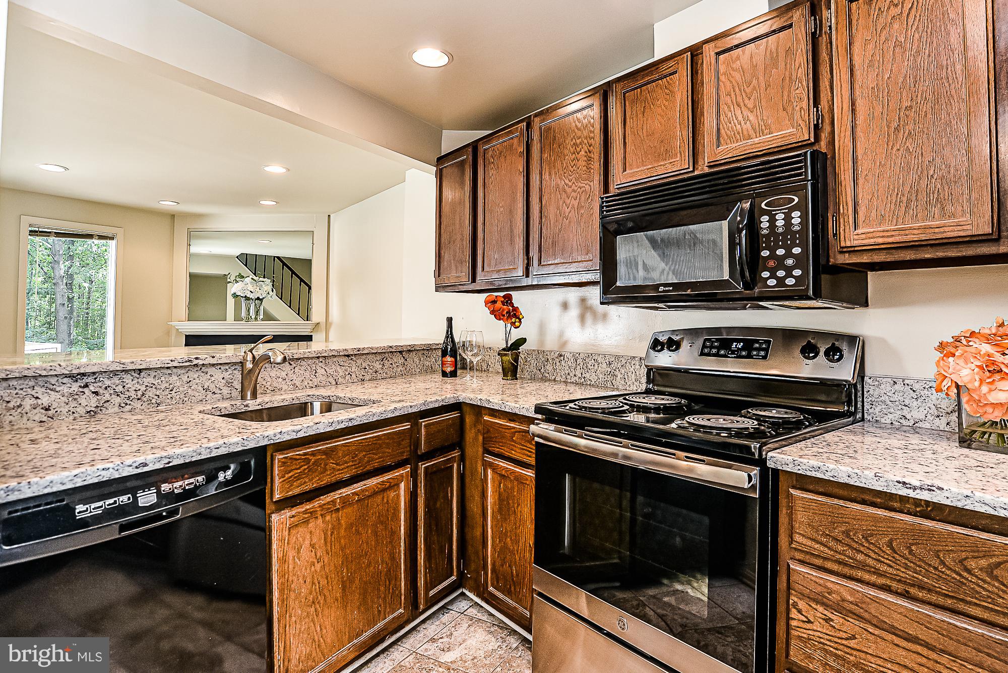 2155 Whisper Way Reston, VA 20191 - Photo 4 of 32 Open concept kitchen w/ brand new stove
